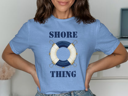 Light blue t-shirt with "SHORE THING" and a nautical life preserver graphic.