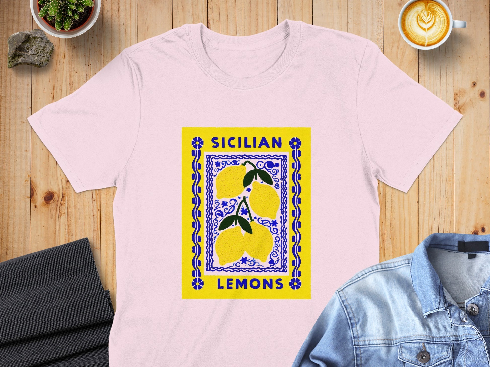 Pink t-shirt featuring a square graphic with three lemons and "Sicilian Lemons" text.