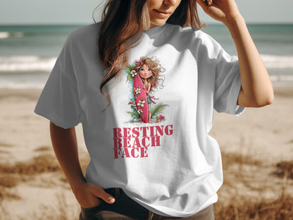 White t-shirt with "Resting Beach Face" graphic and a cartoon surfer girl.