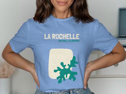 Light blue t-shirt with "LA ROCHELLE CAP SUR L'ATLANTIQUE" and abstract green design.
