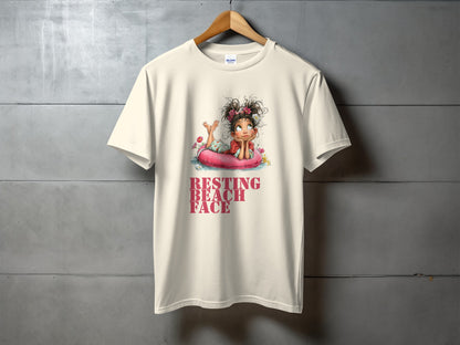 Cream t-shirt with girl on float, "RESTING BEACH FACE" text.