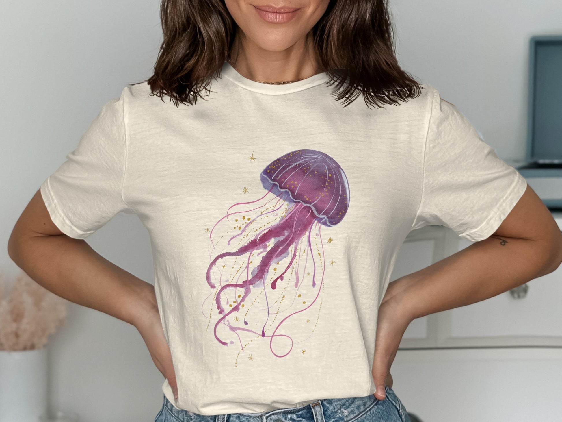 Light cream t-shirt with a purple watercolor jellyfish illustration.