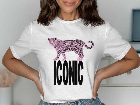 White t-shirt with black "ICONIC" text and a pink leopard graphic.