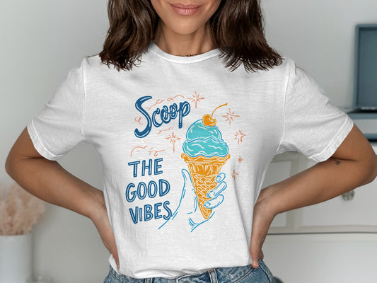 White t-shirt with "Scoop The Good Vibes" and ice cream cone graphic.