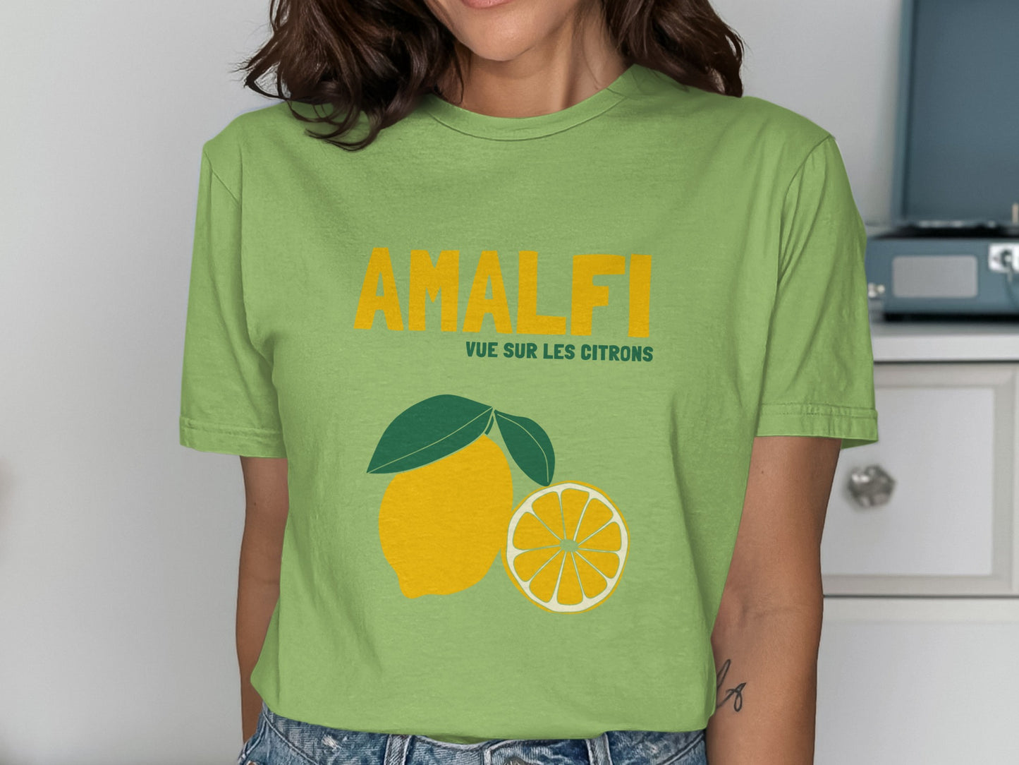 Green t-shirt with "AMALFI" and lemons graphic.
