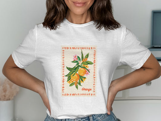 White t-shirt with a botanical illustration of an orange branch.