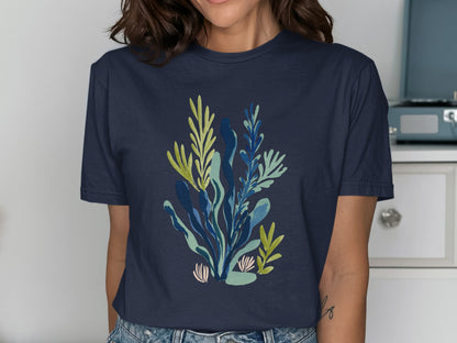 Navy t-shirt with a colorful botanical illustration of seaweed and coral.