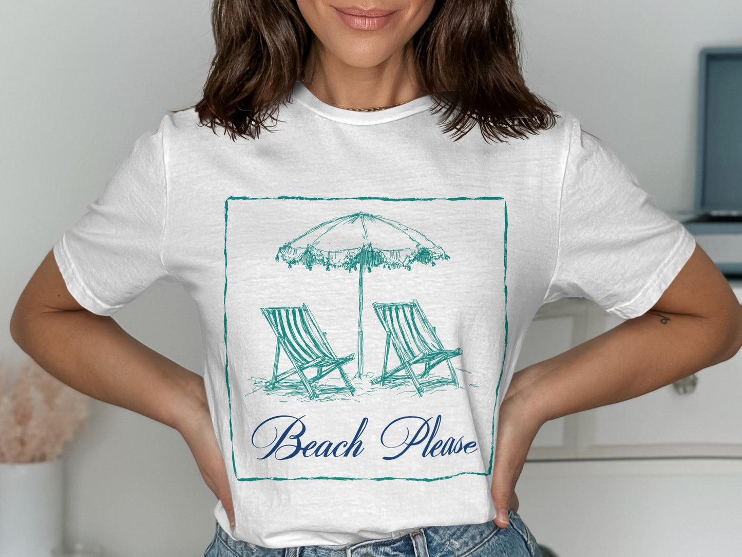 White t-shirt with sketch of beach chairs and umbrella, "Beach Please" text.