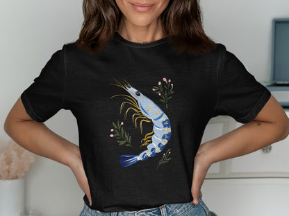 Black t-shirt with a blue shrimp and floral illustration.