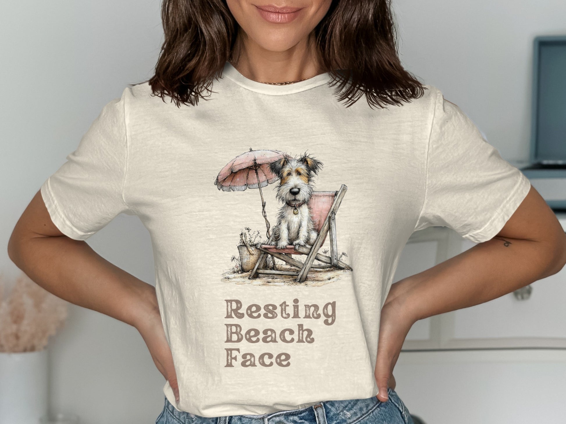 Dog wearing sunglasses sits in a beach chair under an umbrella.