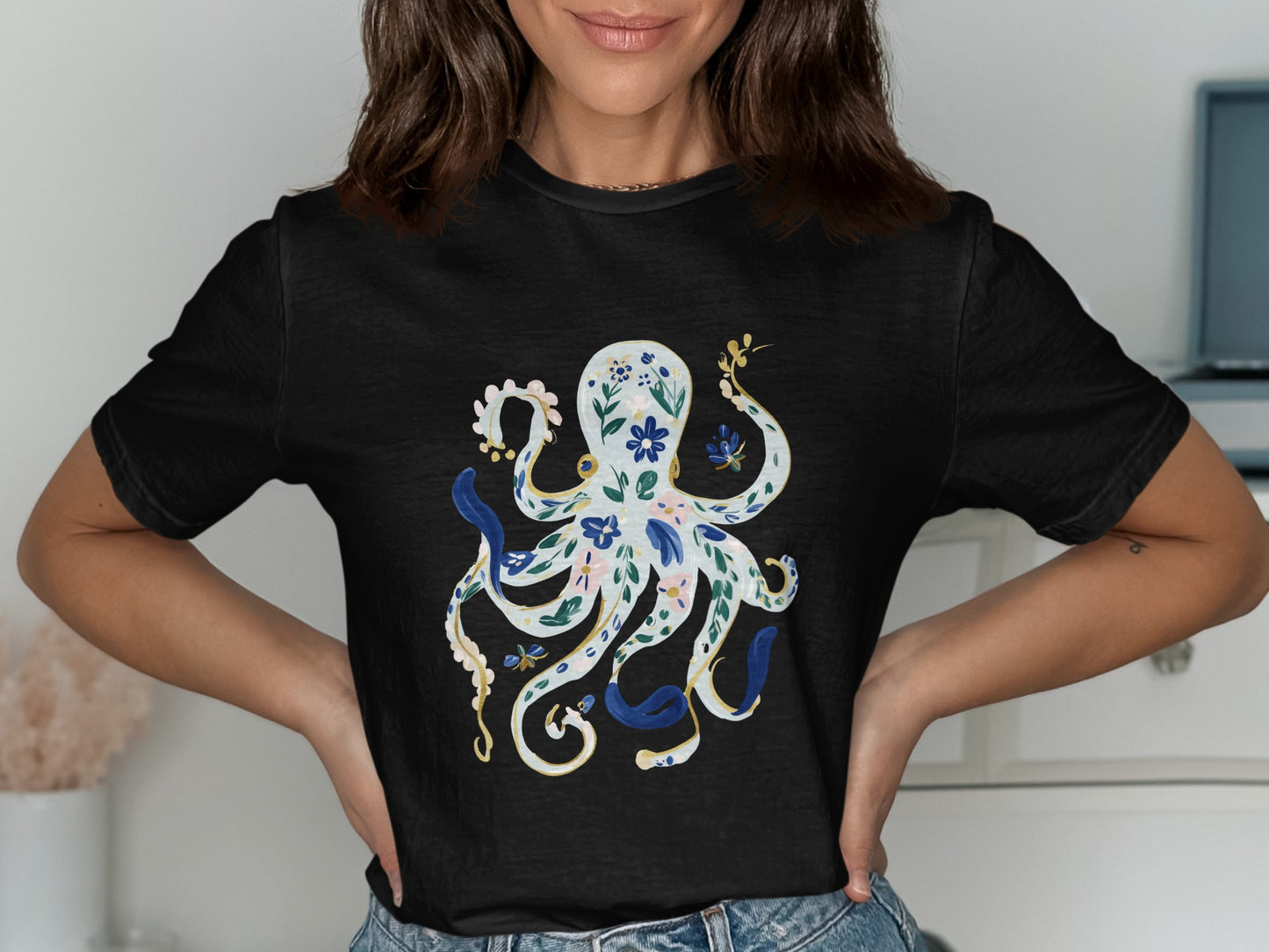 Black t-shirt with a white and blue floral octopus design.