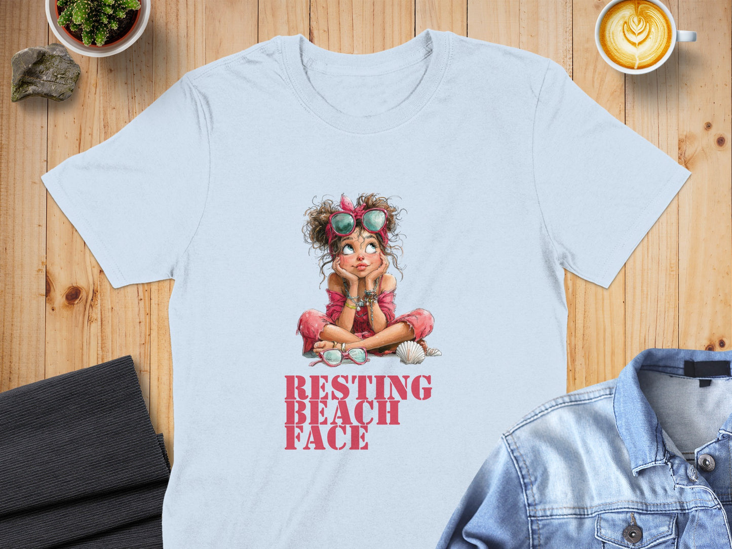 Light blue t-shirt with "RESTING BEACH FACE" graphic of a relaxed girl.