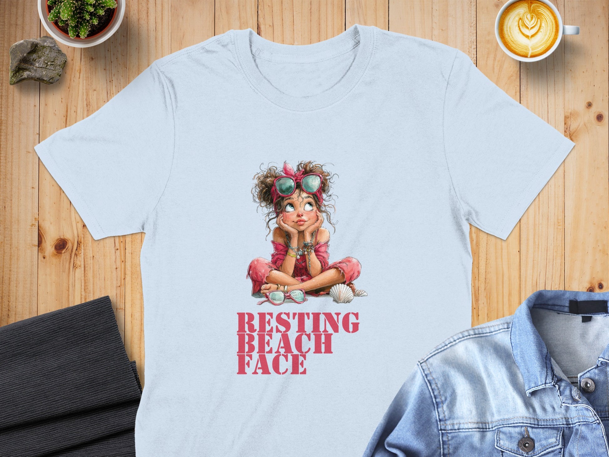 Light blue t-shirt with "RESTING BEACH FACE" graphic of a relaxed girl.