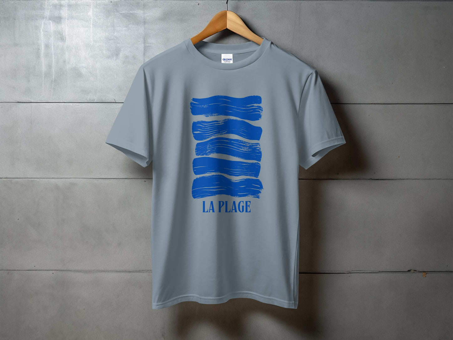 Grey t-shirt with horizontal blue brushstroke design and "LA PLAGE" text.