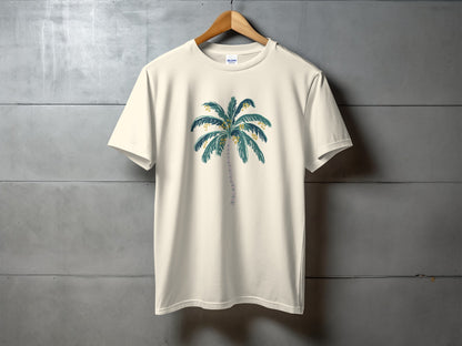 Cream t-shirt with a watercolor palm tree graphic on front.
