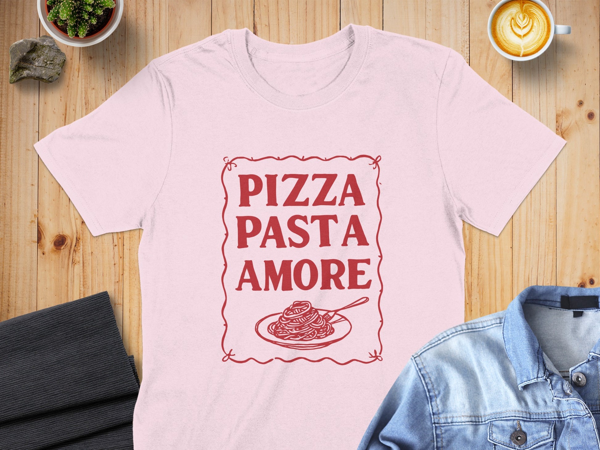 Pink t-shirt with "Pizza Pasta Amore" text and spaghetti graphic.