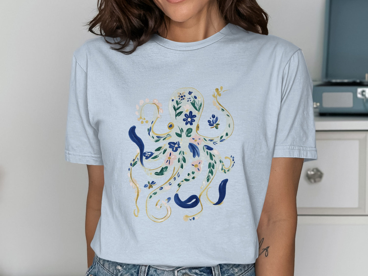 Light blue t-shirt with a floral octopus design.