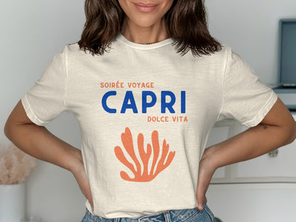 Cream t-shirt with "Soirée Voyage Capri Dolce Vita" text and orange coral graphic.