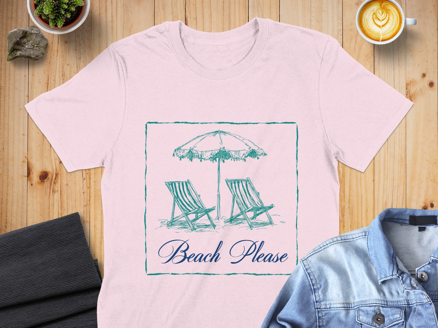 Pink t-shirt with a beach scene graphic and "Beach Please" text.