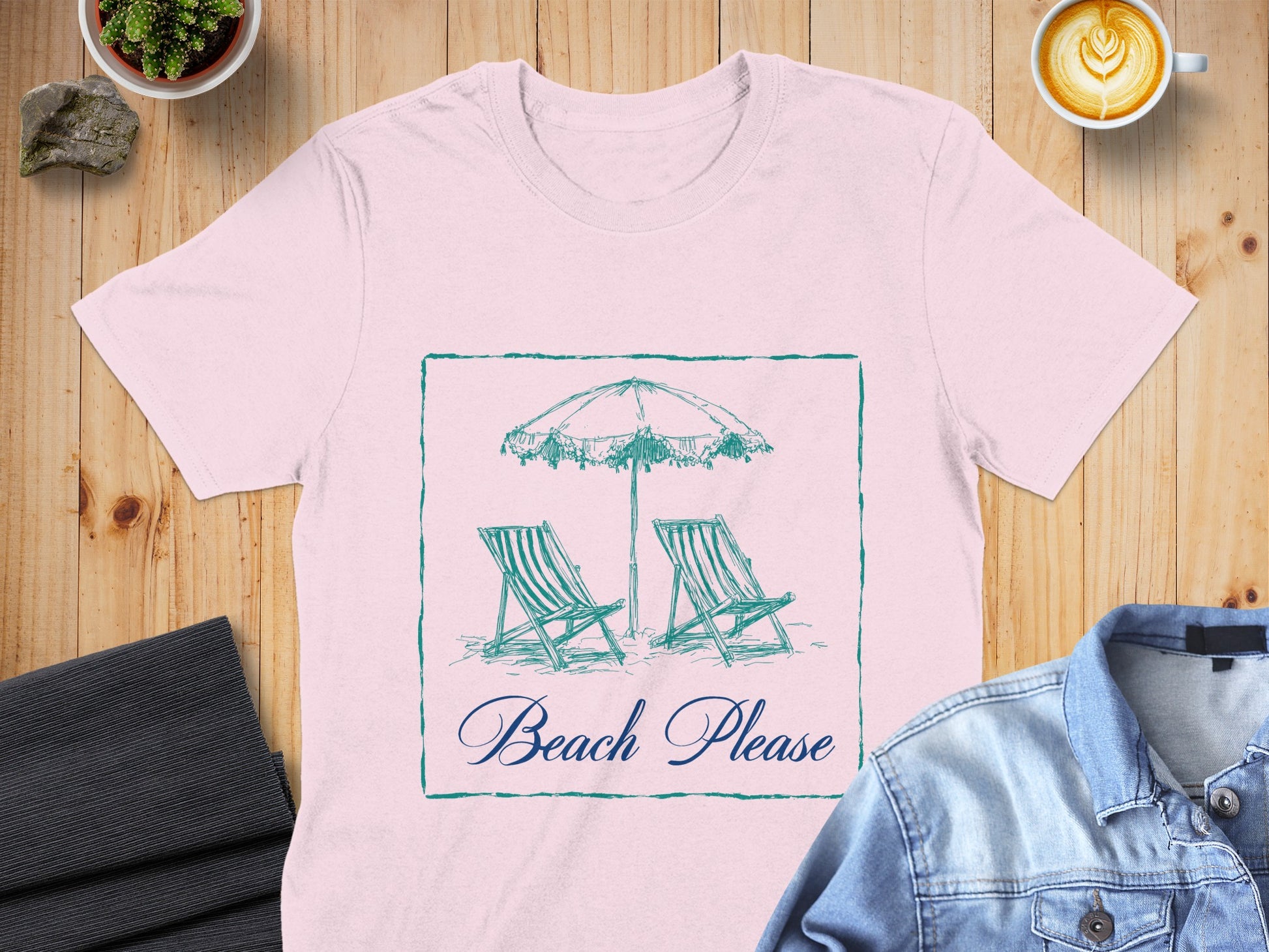 Pink t-shirt with a beach scene graphic and "Beach Please" text.