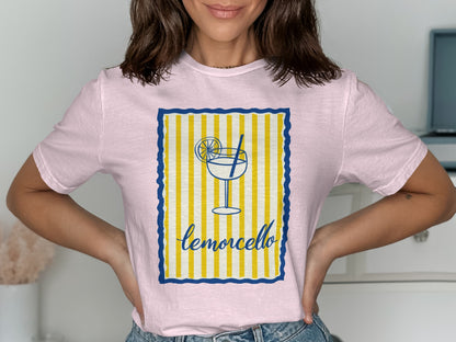 Pink t-shirt with a lemon slice and "limoncello" text in a striped border.