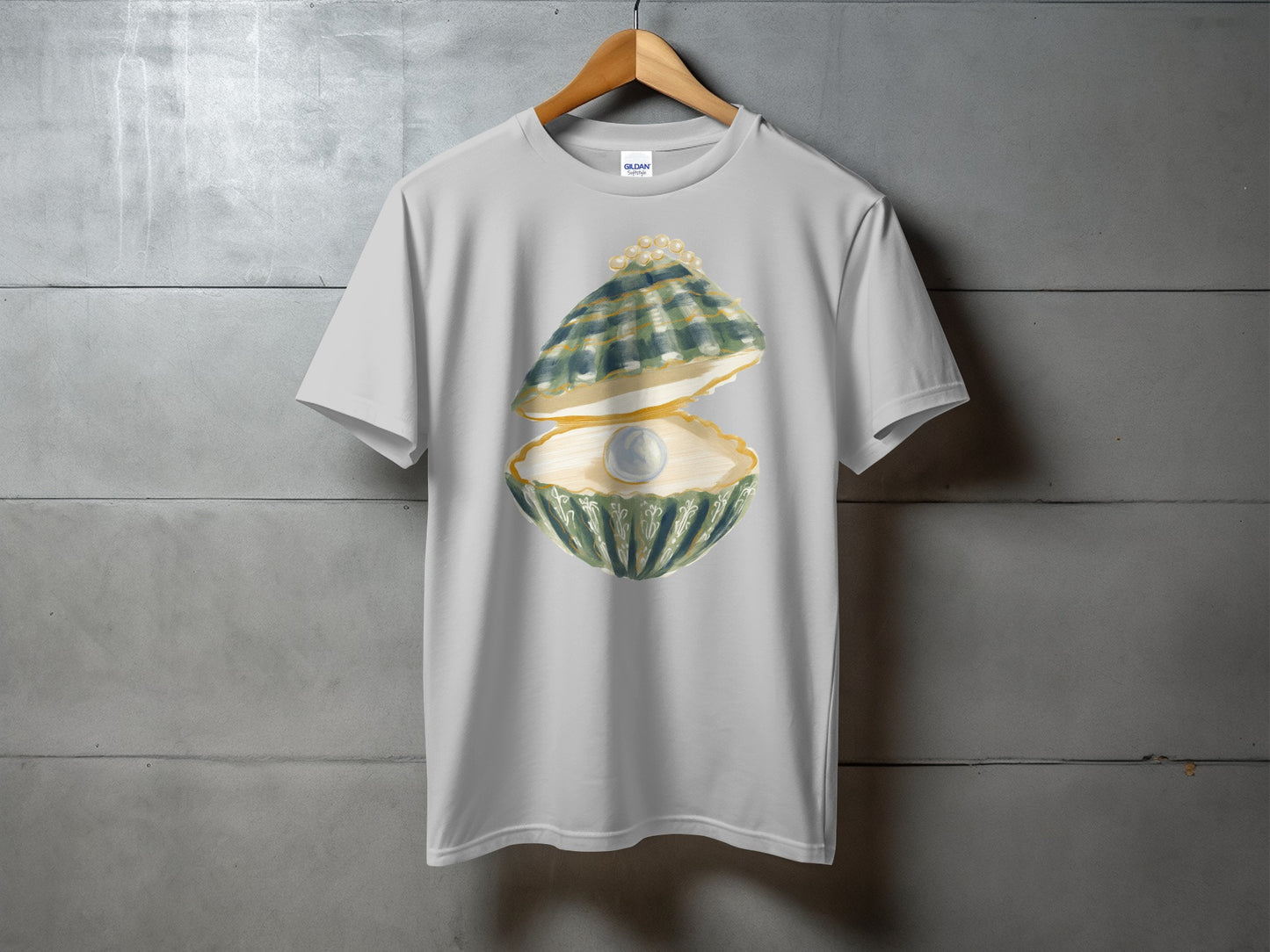 Light grey t-shirt featuring a graphic of an open oyster revealing a pearl.