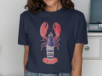 Navy t-shirt featuring a watercolor illustration of a red and blue lobster.