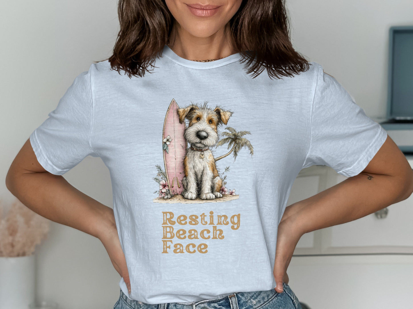 Scruffy dog sitting by a surfboard and palm tree, "Resting Beach Face" text.