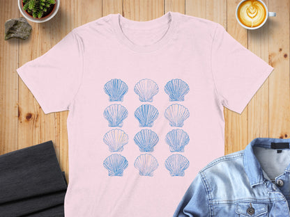 Pink t-shirt with a grid of blue seashell illustrations.