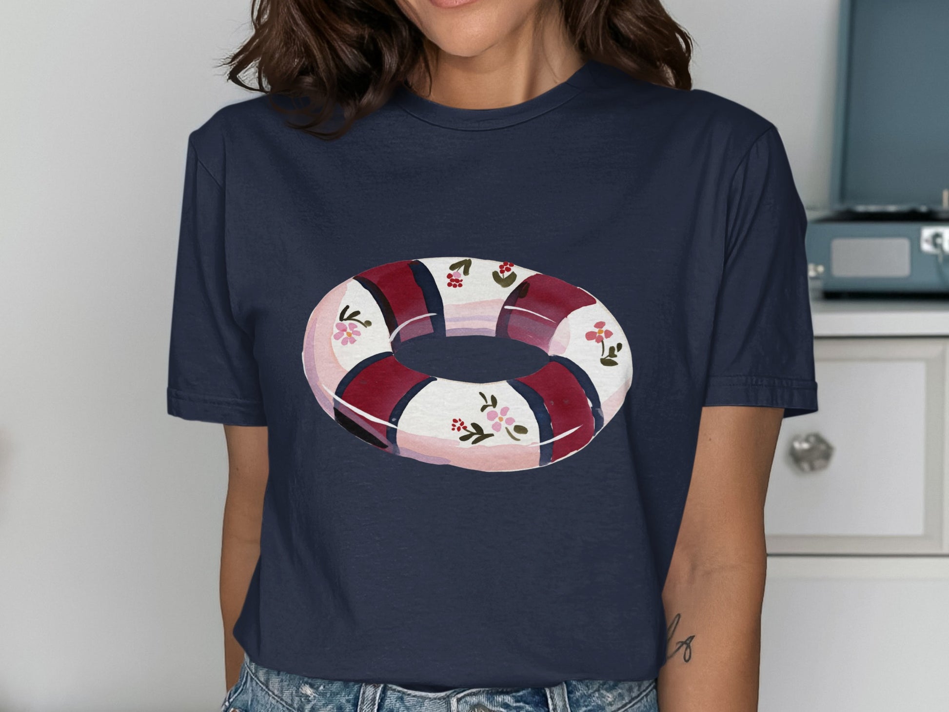 Navy t-shirt featuring a floral inner tube design.