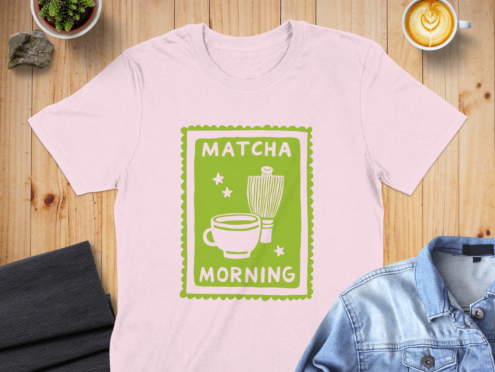 Pink t-shirt with green "Matcha Morning" graphic featuring a whisk and cup.