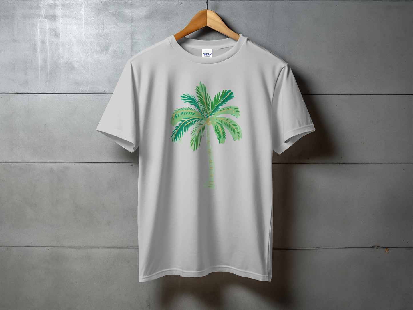 White t-shirt with a green watercolor palm tree graphic on the front.