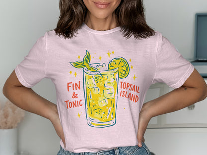 Pink t-shirt with "Fin & Tonic" and "Topsail Island" text above a cocktail.