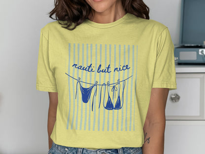 Yellow t-shirt with blue stripes and lingerie hanging on a clothesline.