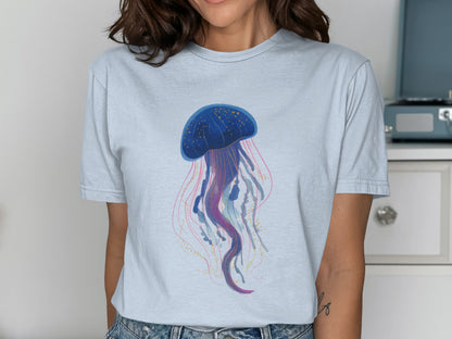 Light blue t-shirt featuring a watercolor illustration of a blue jellyfish.