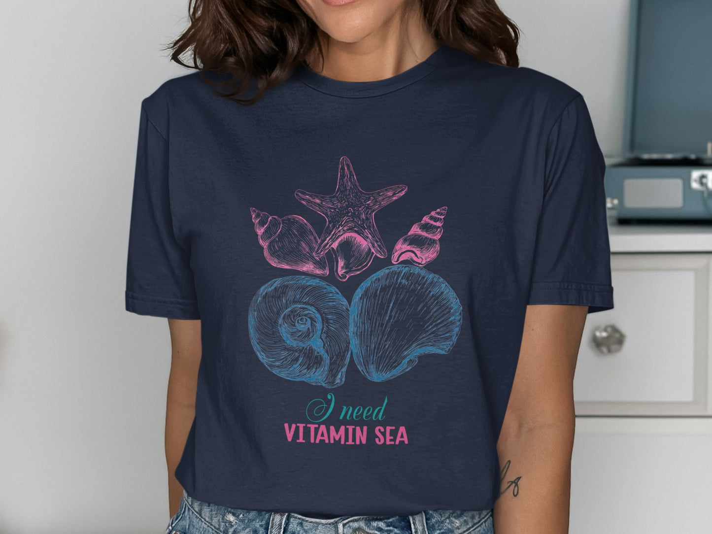 Navy t-shirt with seashells and text "I need vitamin sea".