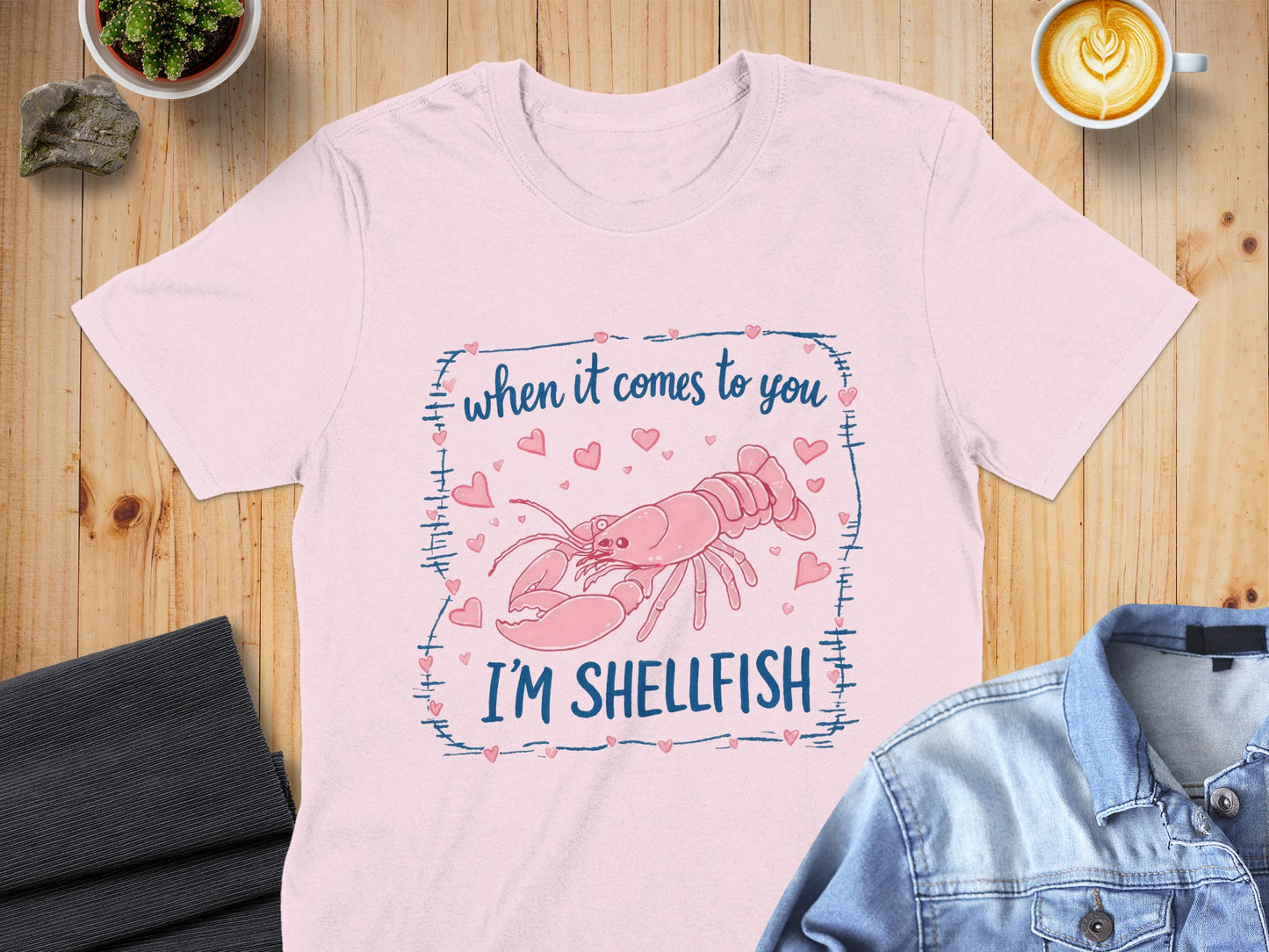 Pink t-shirt with lobster and text "when it comes to you I'M SHELLFISH".