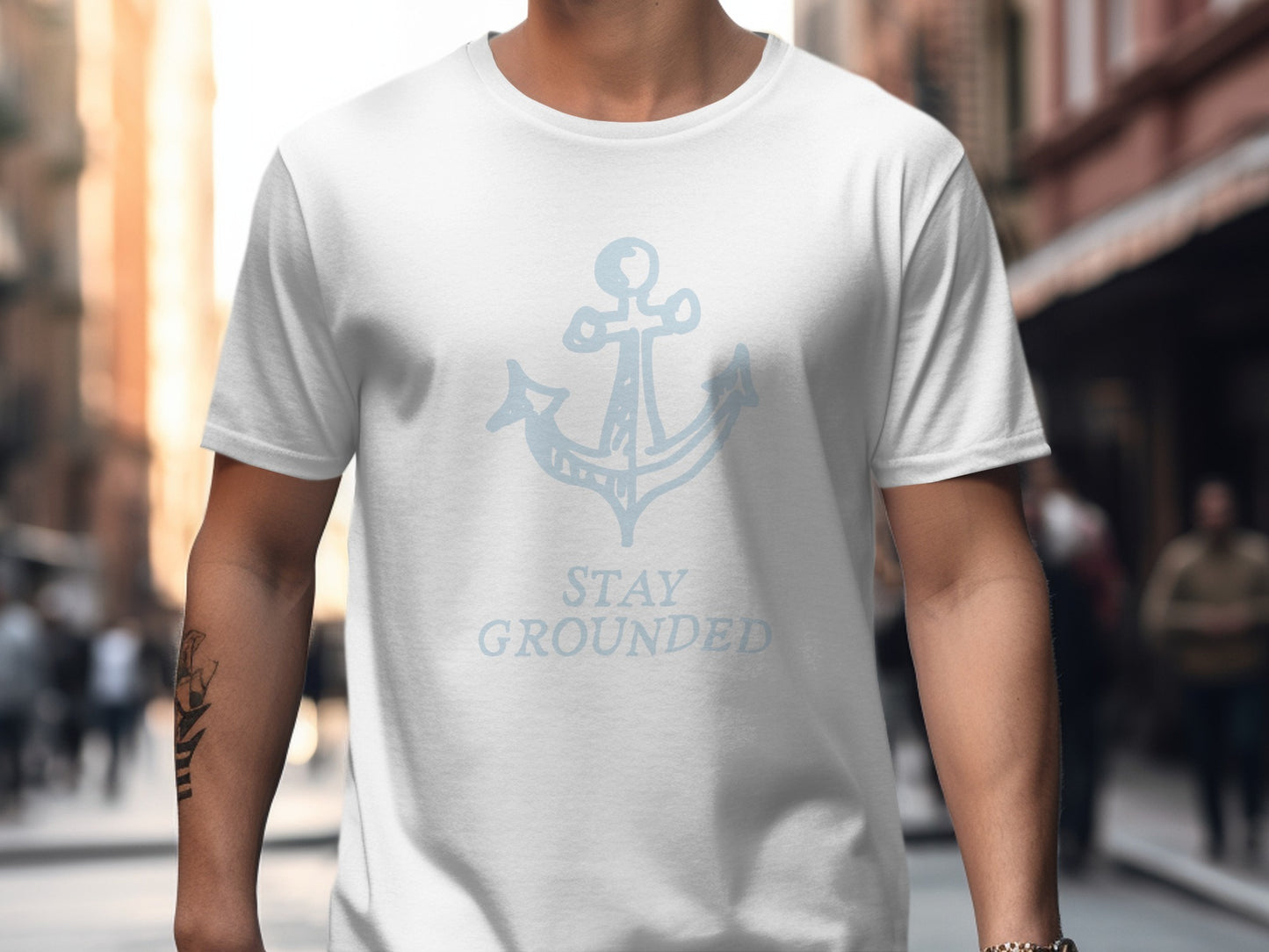 White t-shirt with anchor graphic and "STAY GROUNDED" text.