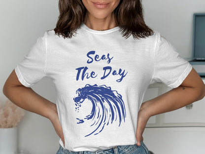 White t-shirt with blue wave graphic and text "Seas The Day".