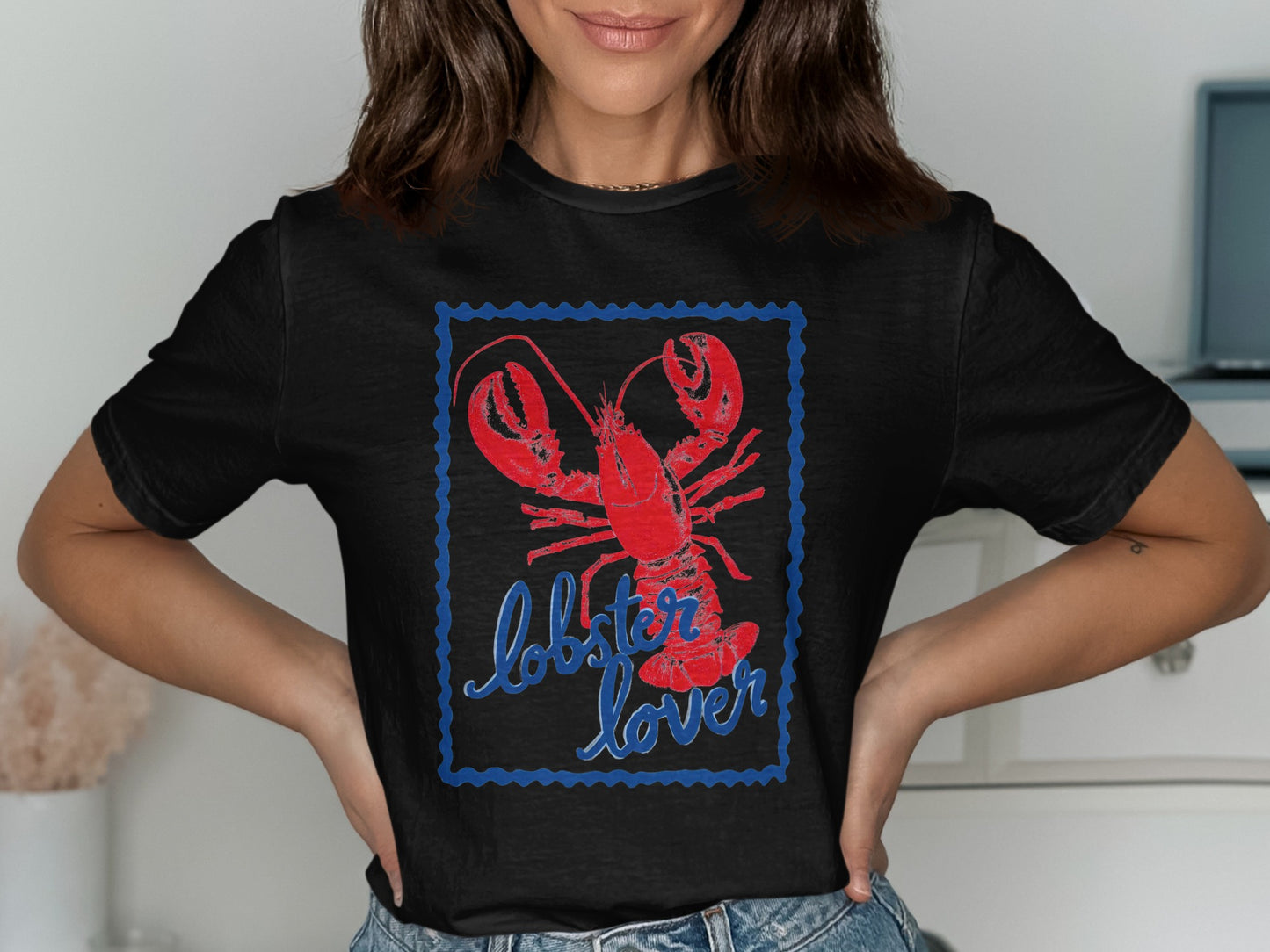 Black t-shirt with red lobster and "lobster lover" text in blue.