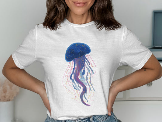White t-shirt with a blue jellyfish illustration and pink and gold accents.