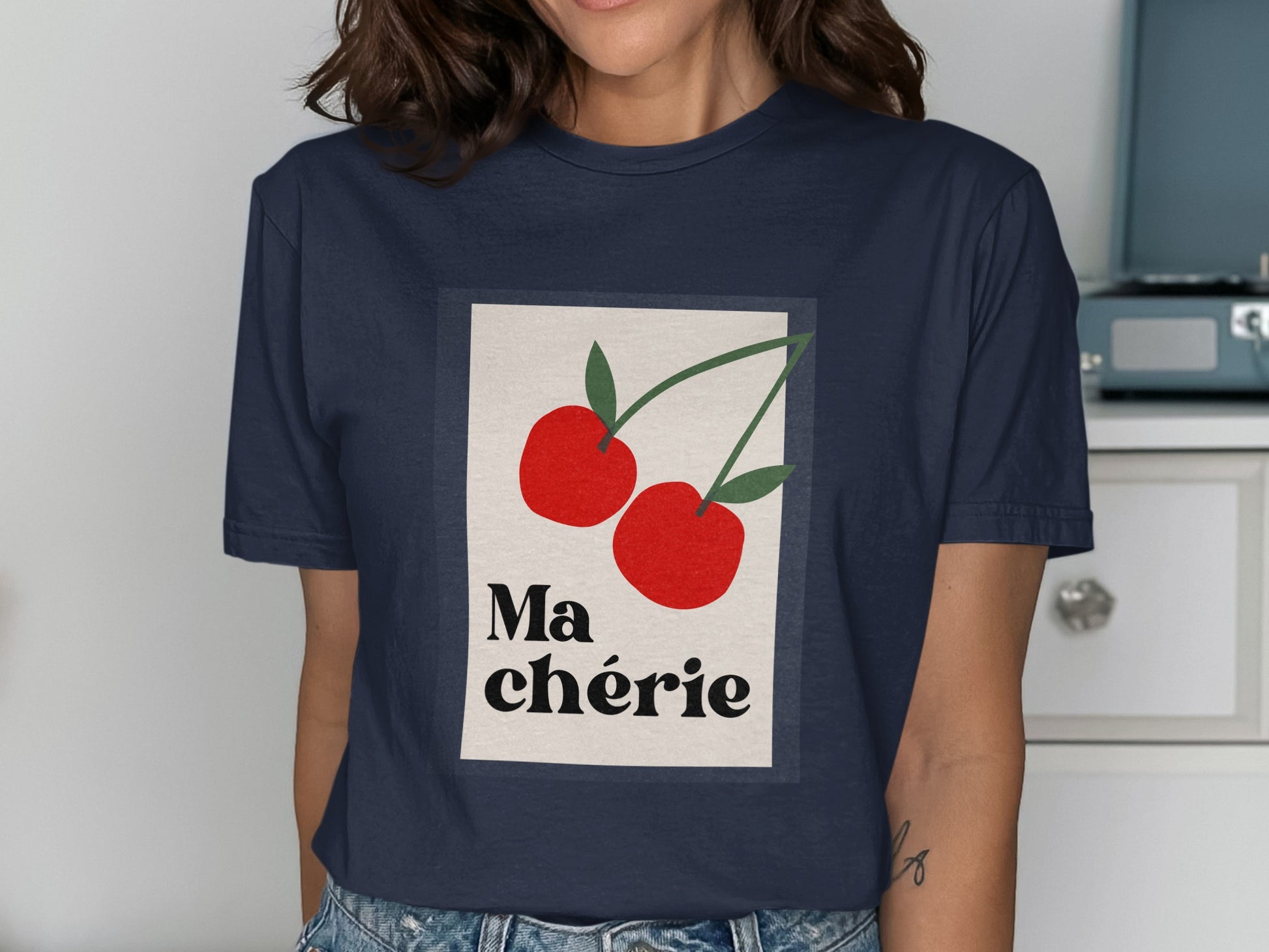 Navy t-shirt with graphic of two red cherries and text "Ma chérie".