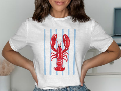 White t-shirt with red lobster graphic and blue vertical stripes.