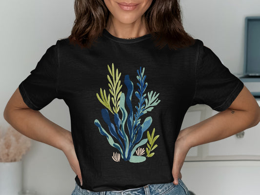 Black t-shirt with a blue and green abstract botanical print.