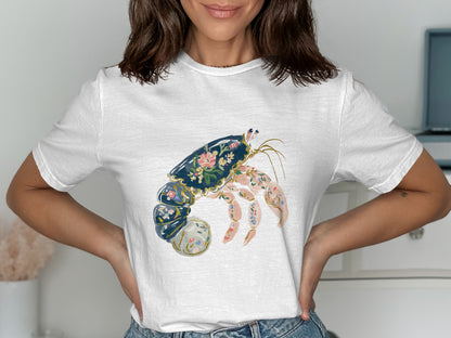 White t-shirt with a floral hermit crab graphic.