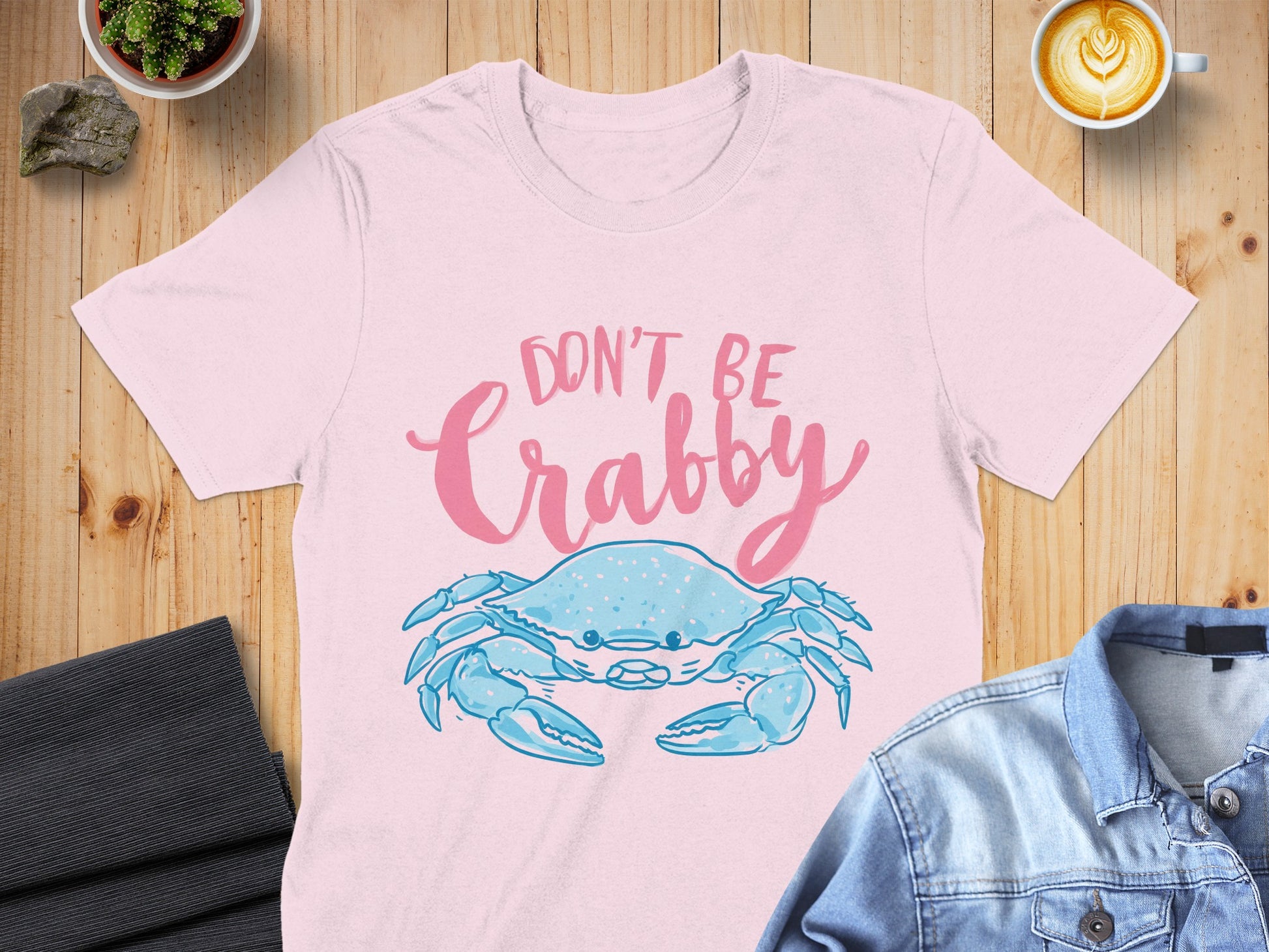 Pink t-shirt with a blue crab and "DON'T BE CRABBY" text.