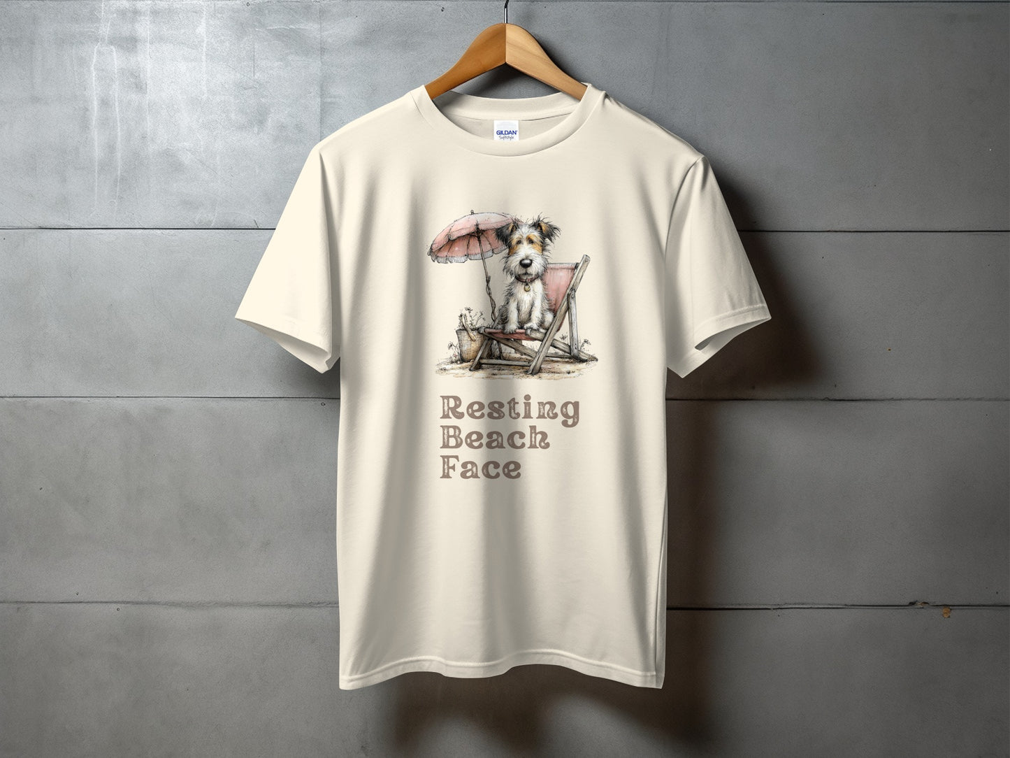 Cream t-shirt with "Resting Beach Face" and a dog on a beach chair.