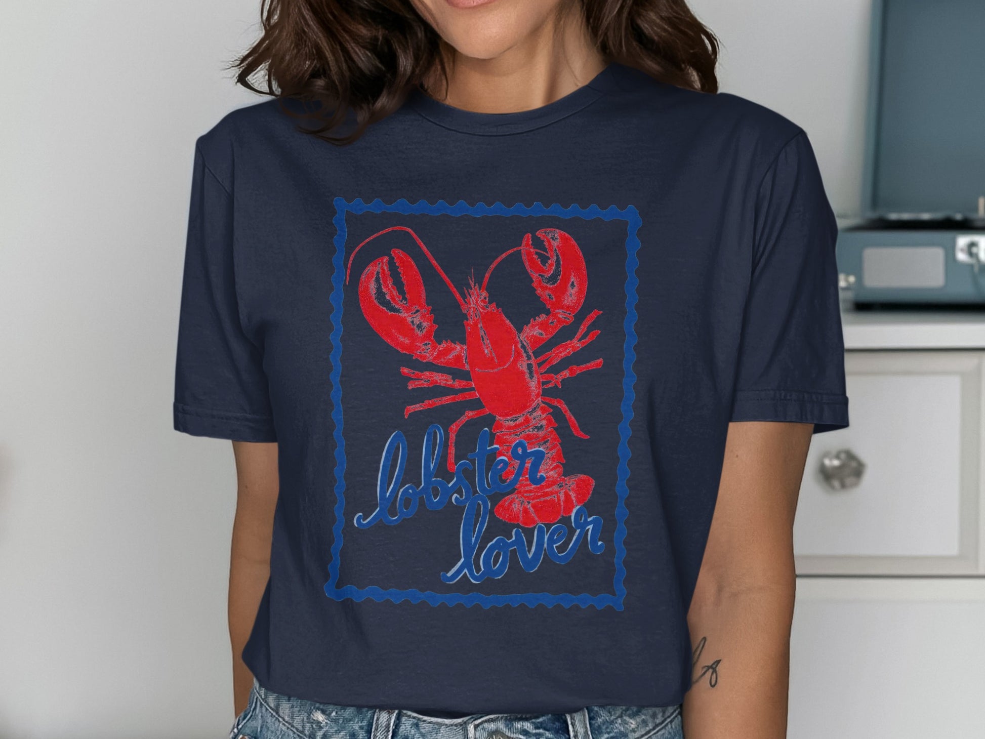 Navy blue t-shirt with red lobster and "lobster lover" text.