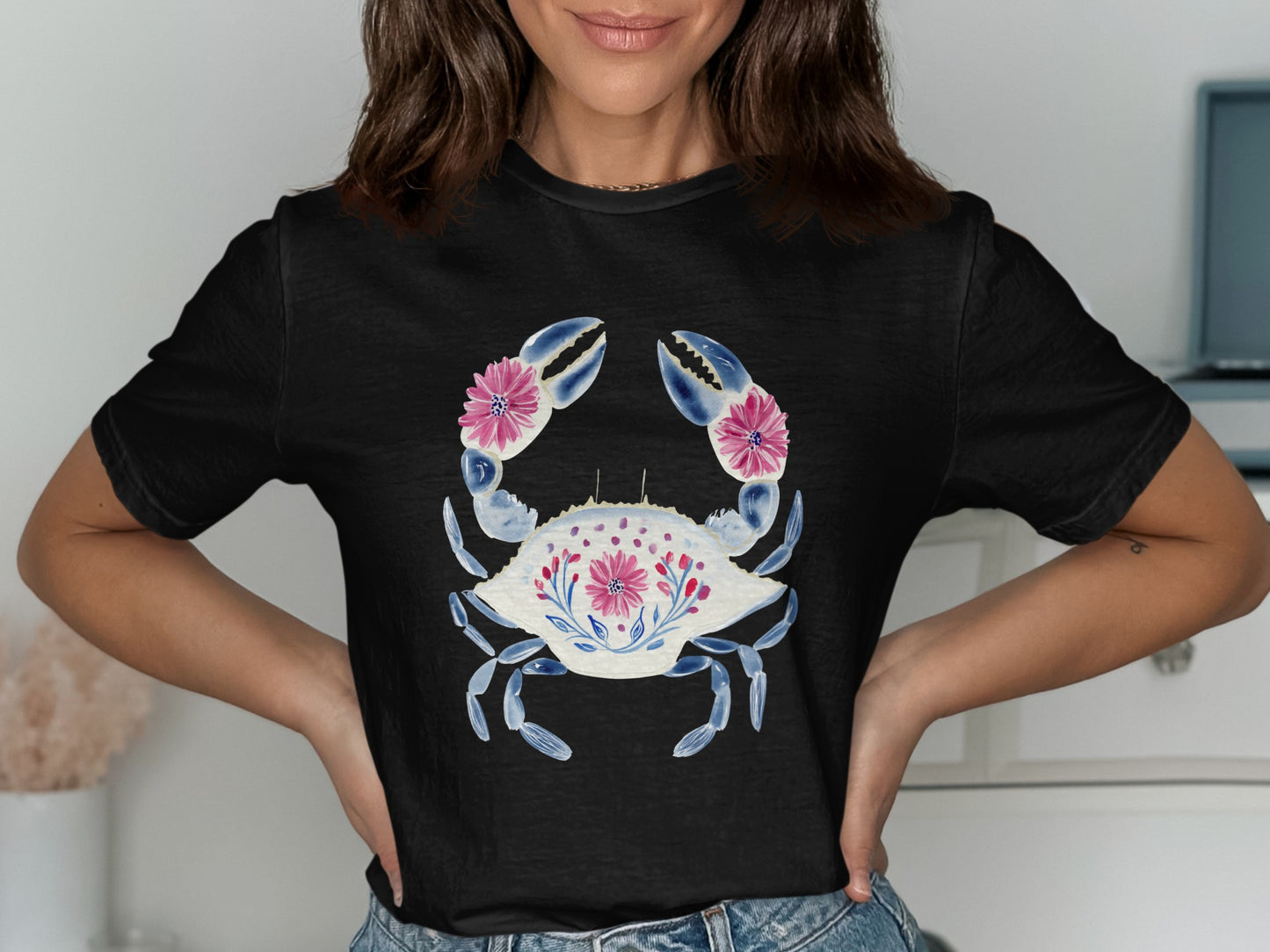 Black t-shirt with watercolor blue crab and pink floral design.