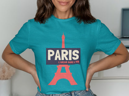 Turquoise t-shirt with "PARIS L'AMOUR DANS L'AIR" and Eiffel Tower graphic.